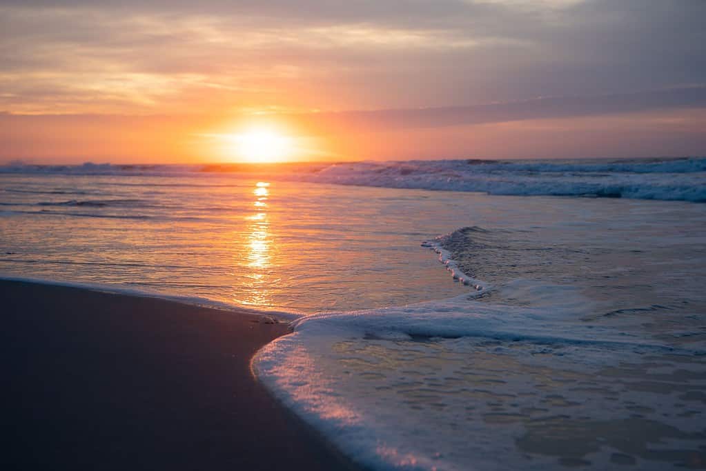 Atlantic Beach Sunrise Reflection on Ocean Water with Foam