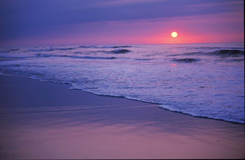 The sun rises over the Atlantic Ocean on the North Carolina coast.