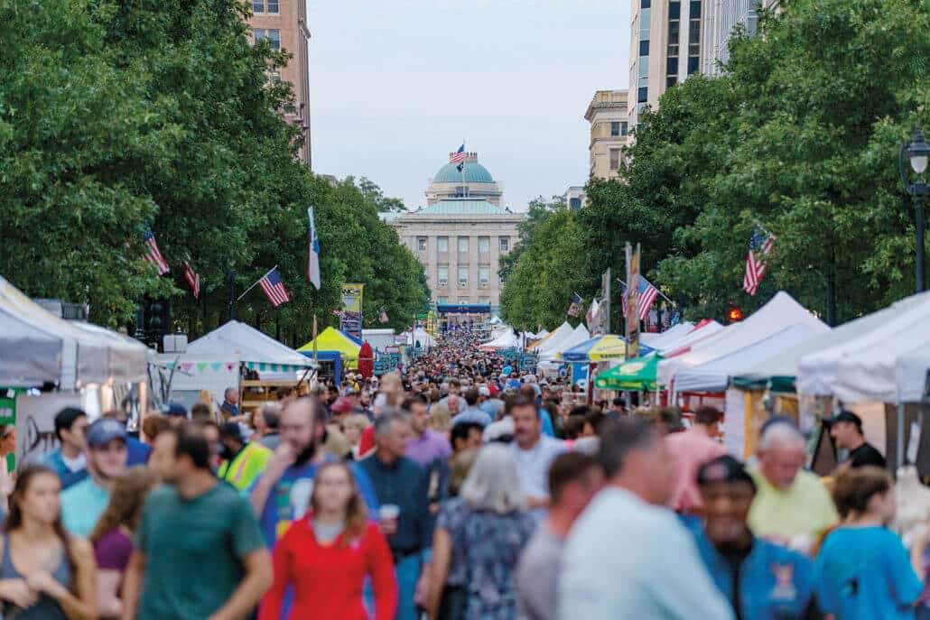 People pack the streets of Raleigh during the IBMA World of Bluegrass event.