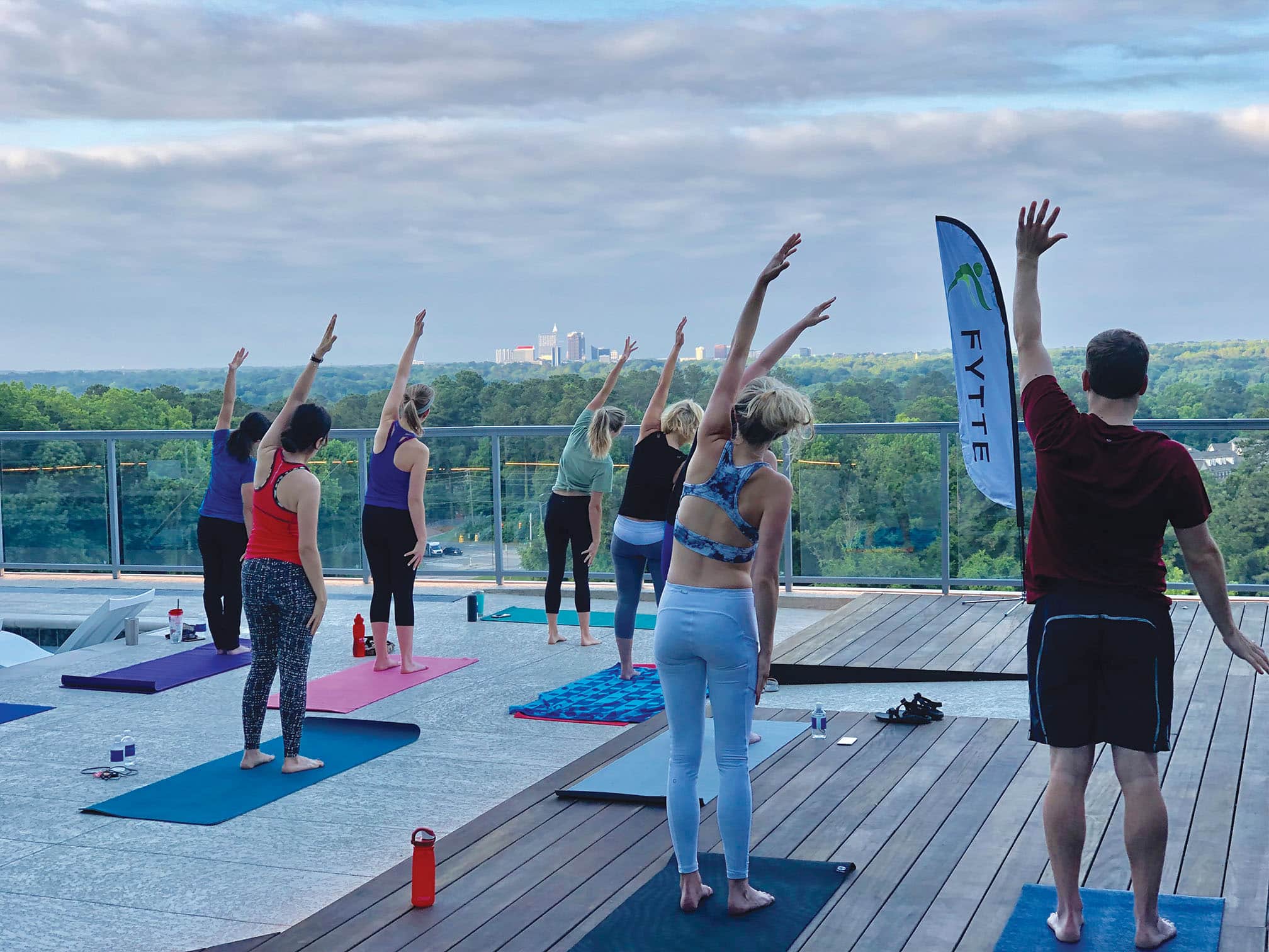 Fytte customers engaging in a sunrise yoga session